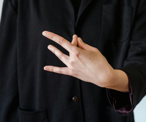 Close up of hands in dhyana mudra during meditation session