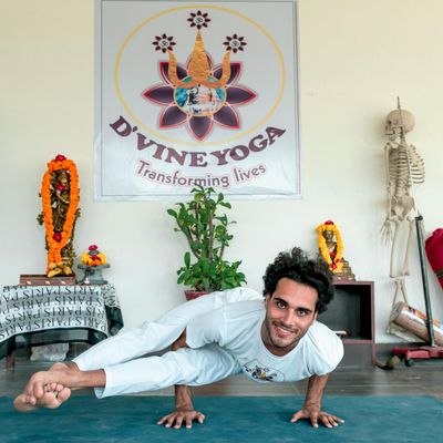 Yoga instructor Olga Zarichna smiling in a warm studio environment